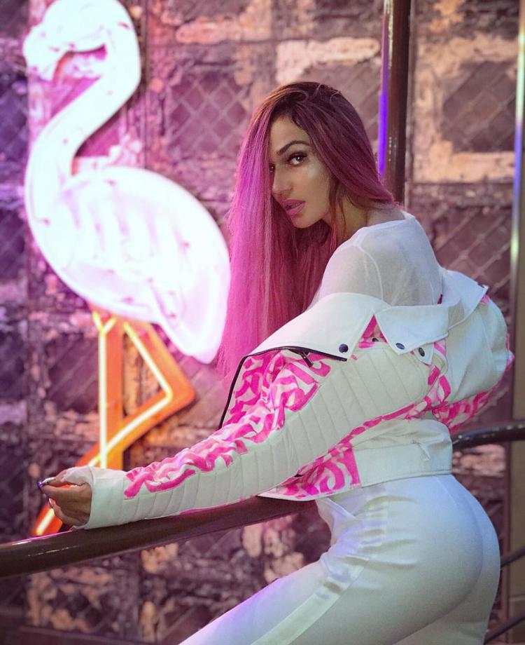 Alena Vodonaeva in white suit