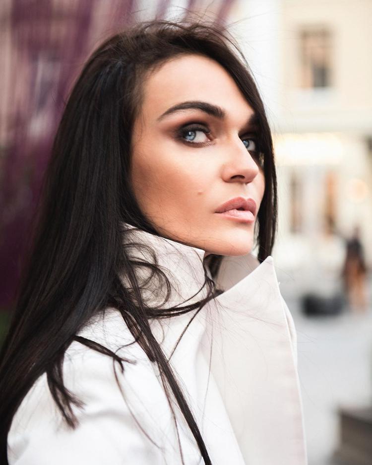 Alena Vodonaeva in a white cape