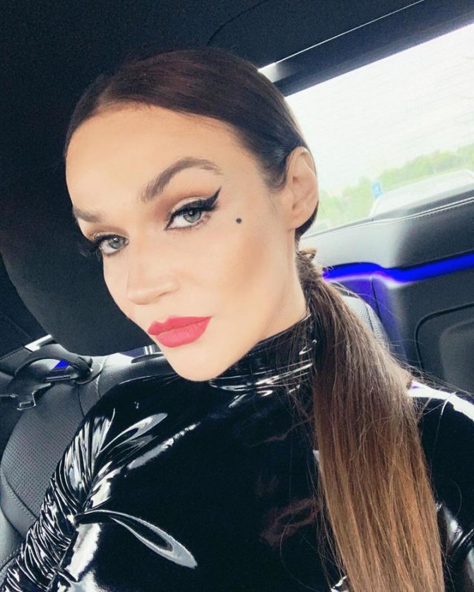 Alena Vodonaeva in a leather suit