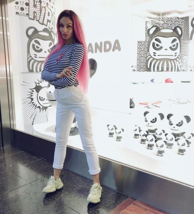 Alena Vodonaeva in a striped turtleneck