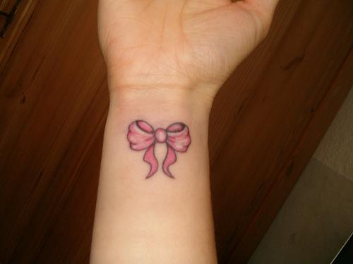 Bow on the wrist tattoo