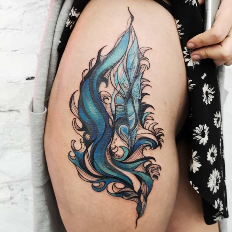 Que signifie le tatouage de plumes