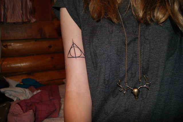 Deathly Hallows tattoo on the biceps