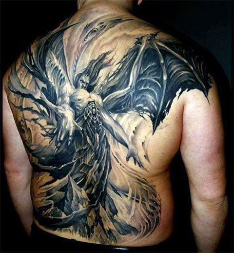 Chinese demon head tattoo on his back
