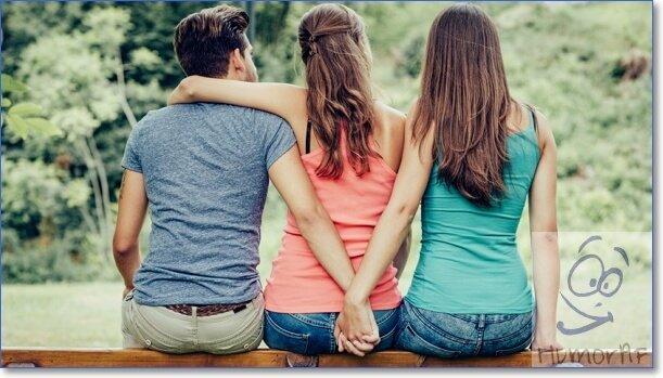 Kuva miehestä ja tytöstä, jotka istuvat takaperin