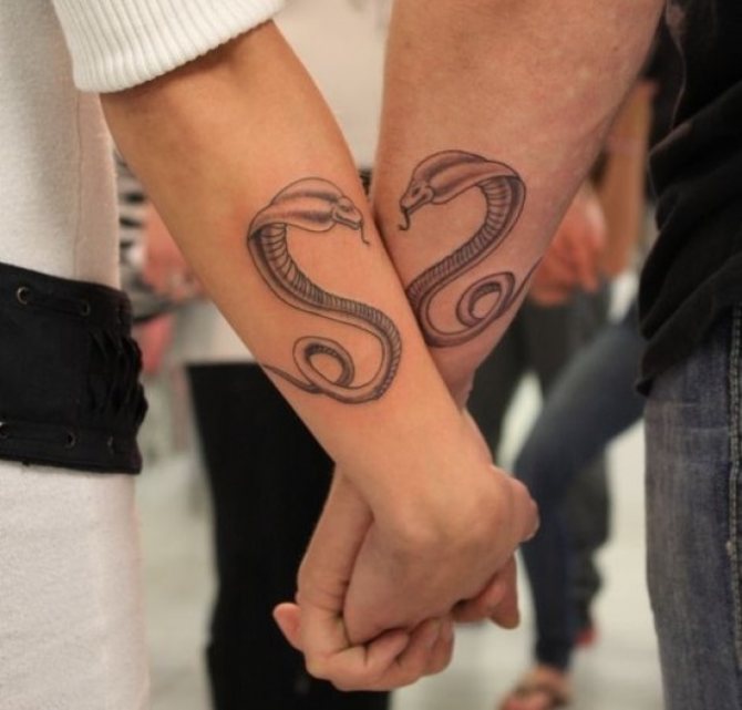 Elegant paired tattoo as a snake
