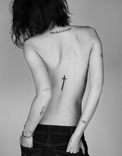 Cross-tattoo on spine