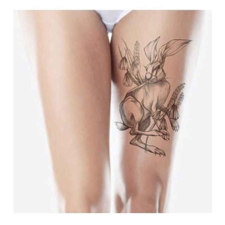 Rabbit tattoo on the hip