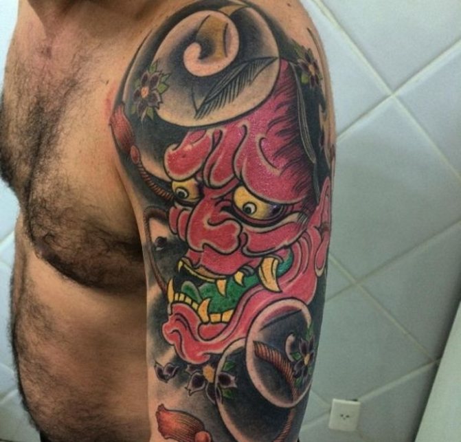 Mask of Chania. Sketch, meaning of a tattoo on his forearm, back, hand, leg and shoulder