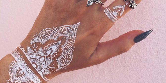White henna mehendi on the arm