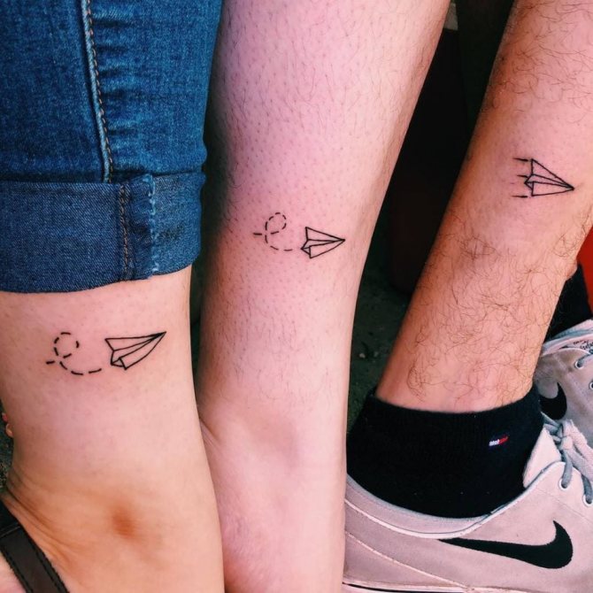 Miniature tattoo that looks like paper airplanes