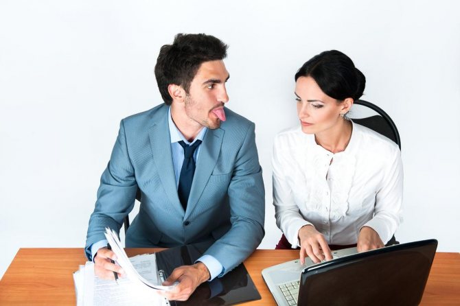 A man shows his tongue to a woman.