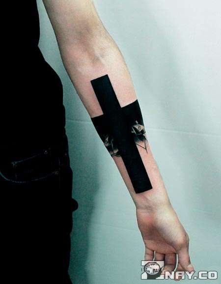 Arm with black tattoo