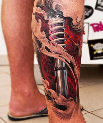 Tattoo shock absorber on the leg. Foto, meaning, sketches