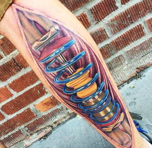 Tattoo shock absorber on the leg. Photo, meaning, sketches