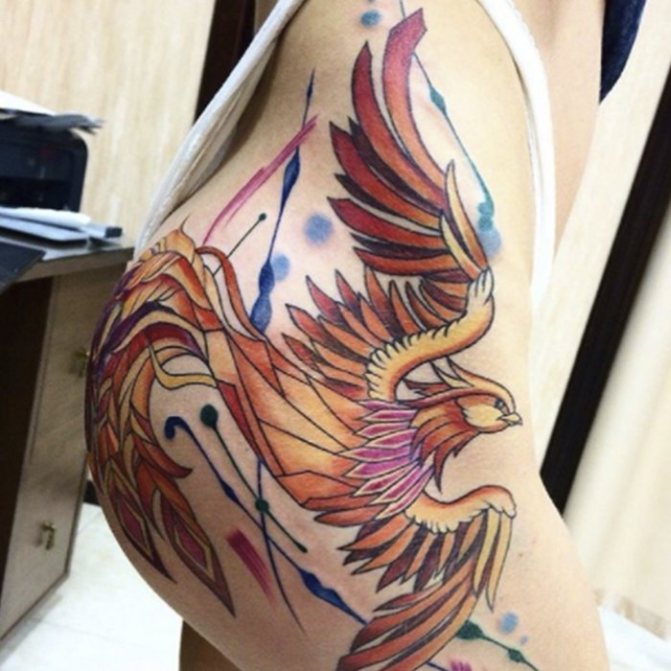 tattoo phoenix on his thigh