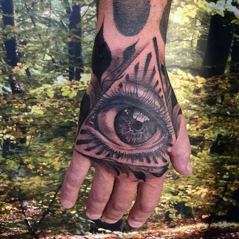 eye tattoo in a triangle