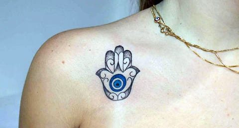 Tattoo of a Turkish hamster on a girl's collarbone