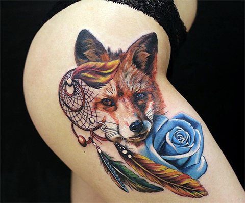 Tatouage d'un attrape-rêves et d'un renard