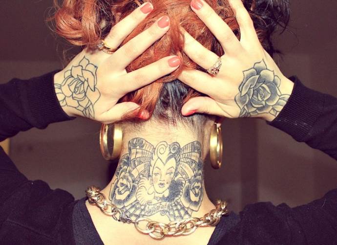 Tattoo on hands and neck of a girl