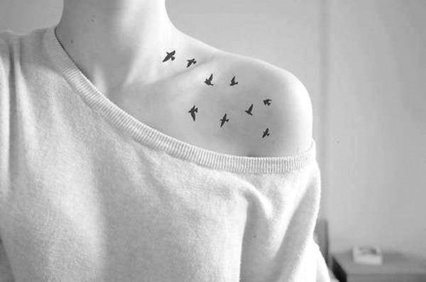 Tattoos on the collarbone for girls. Sketches, female captions, patterns, birds, flowers, stars