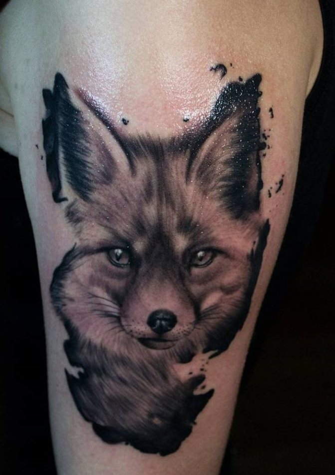 Black fox tattoo on forearm