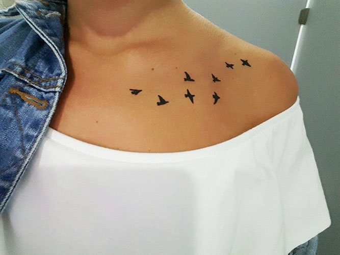 Tattoo of birds on the collarbone. Photos, meaning, sketches