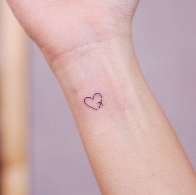 airplane tattoo on hand