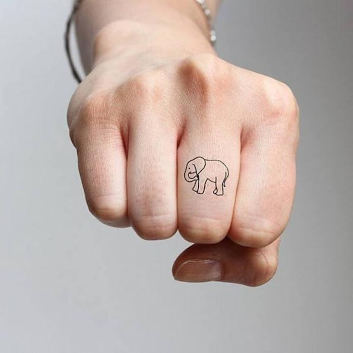 Tattoo elephant on his finger