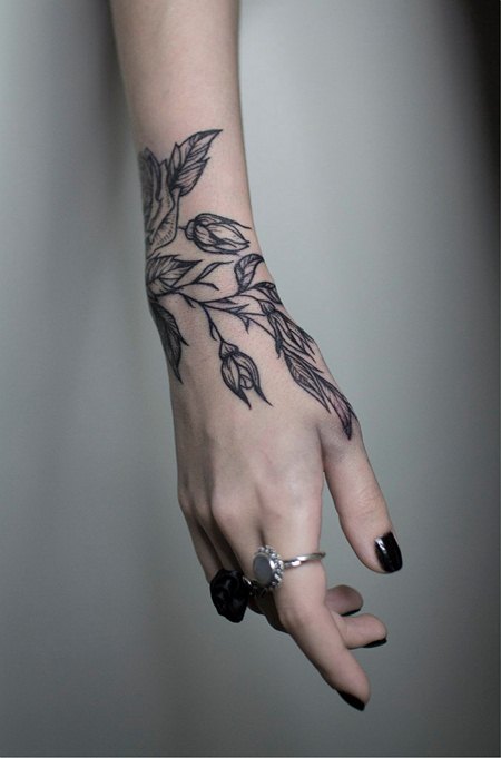 Tattoo bracelet on the arm for girls. Tattoo above the elbow, meaning, flowers, photo