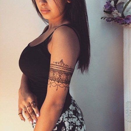 Tattoo bracelet on the arm for girls. Tattoo above the elbow, meaning, colors, photo