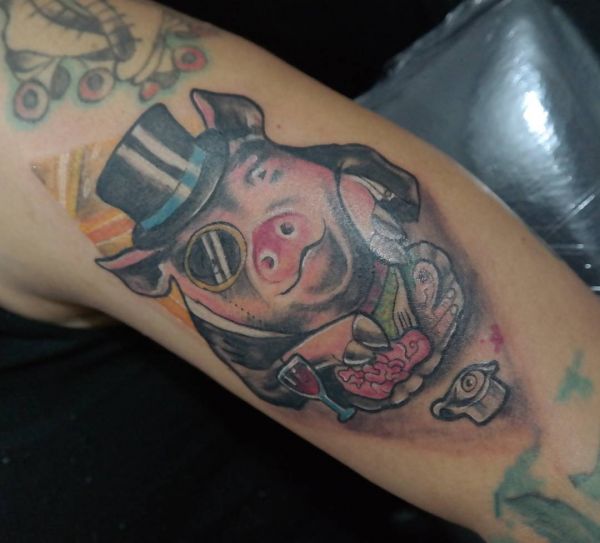 Tattoo of a pig in a hat