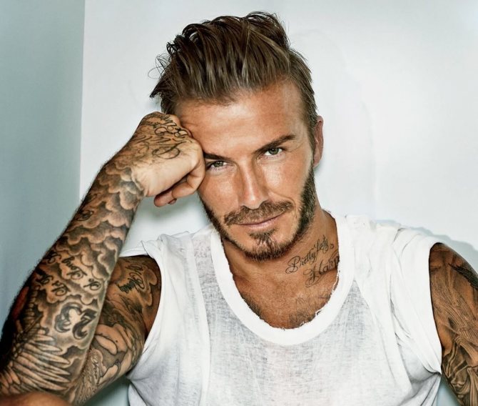 David Beckham tattooed on his arms
