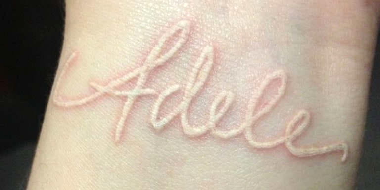 Tattoos on the palm, on the wrist and fingers