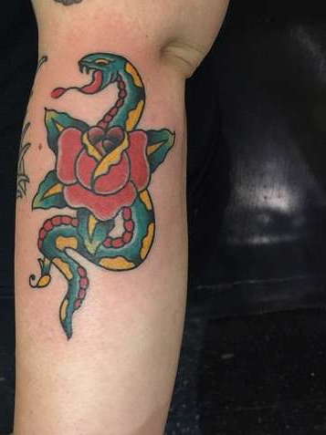 Typical old school style snake and rose tattoo