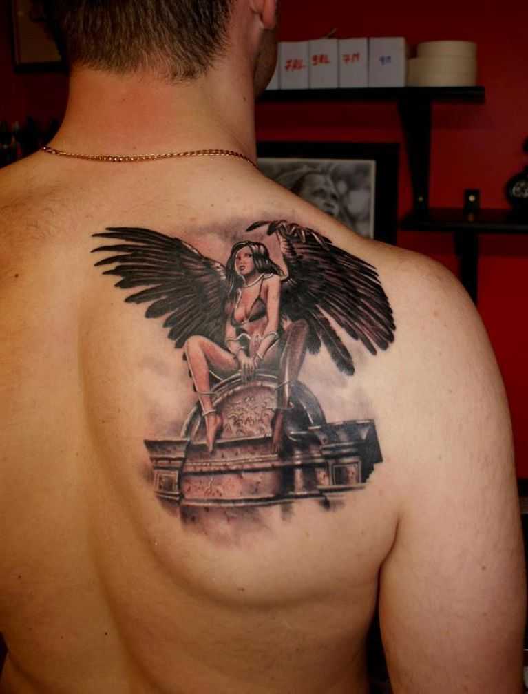 Woman with wings applied as a tattoo as a talisman