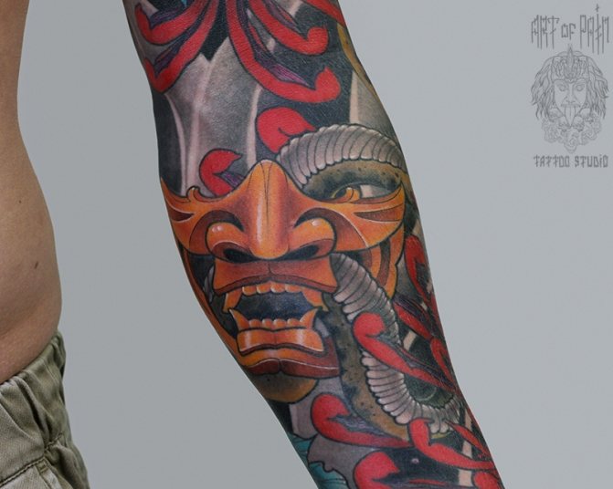 Meaning of tattoo with a demon mask