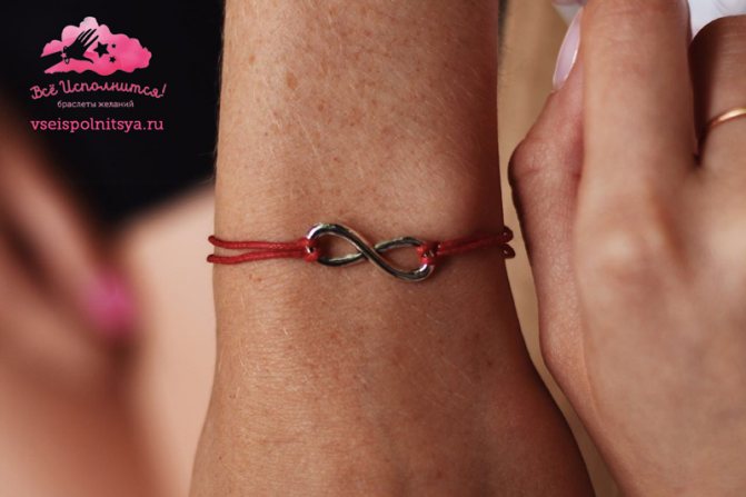 signe, symbole, infini sur un fil rouge